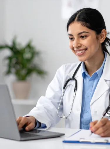 Doctor using a laptop for an online telemedicine consultation